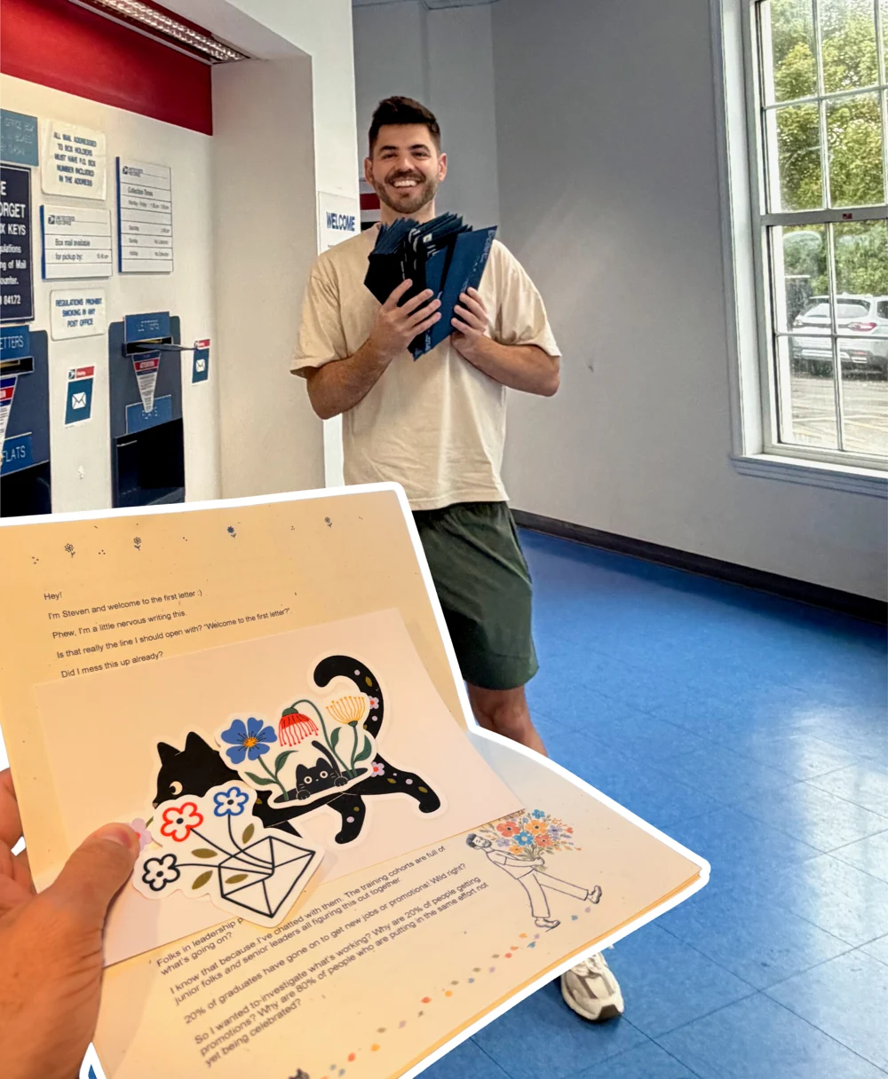 Steven holding the first batch of letters at the post office