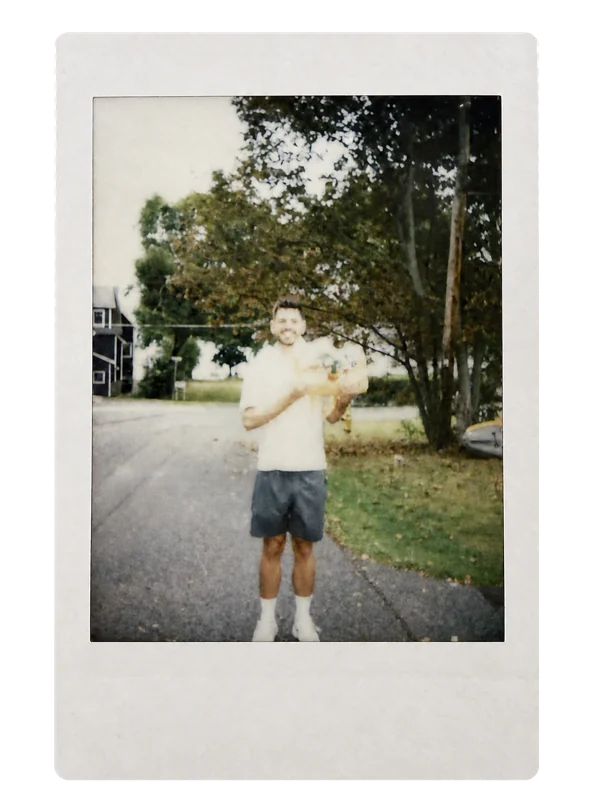 A Polaroid of Steven holding the first letters before posting them